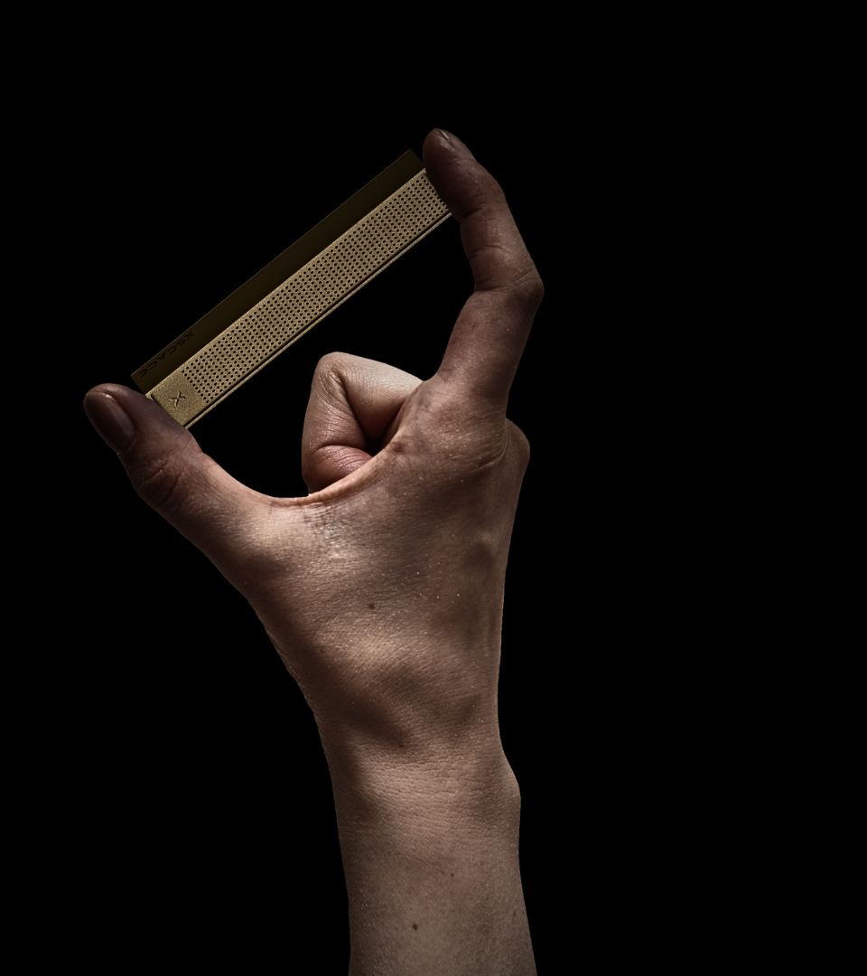 Bonsai speaker held between fingers